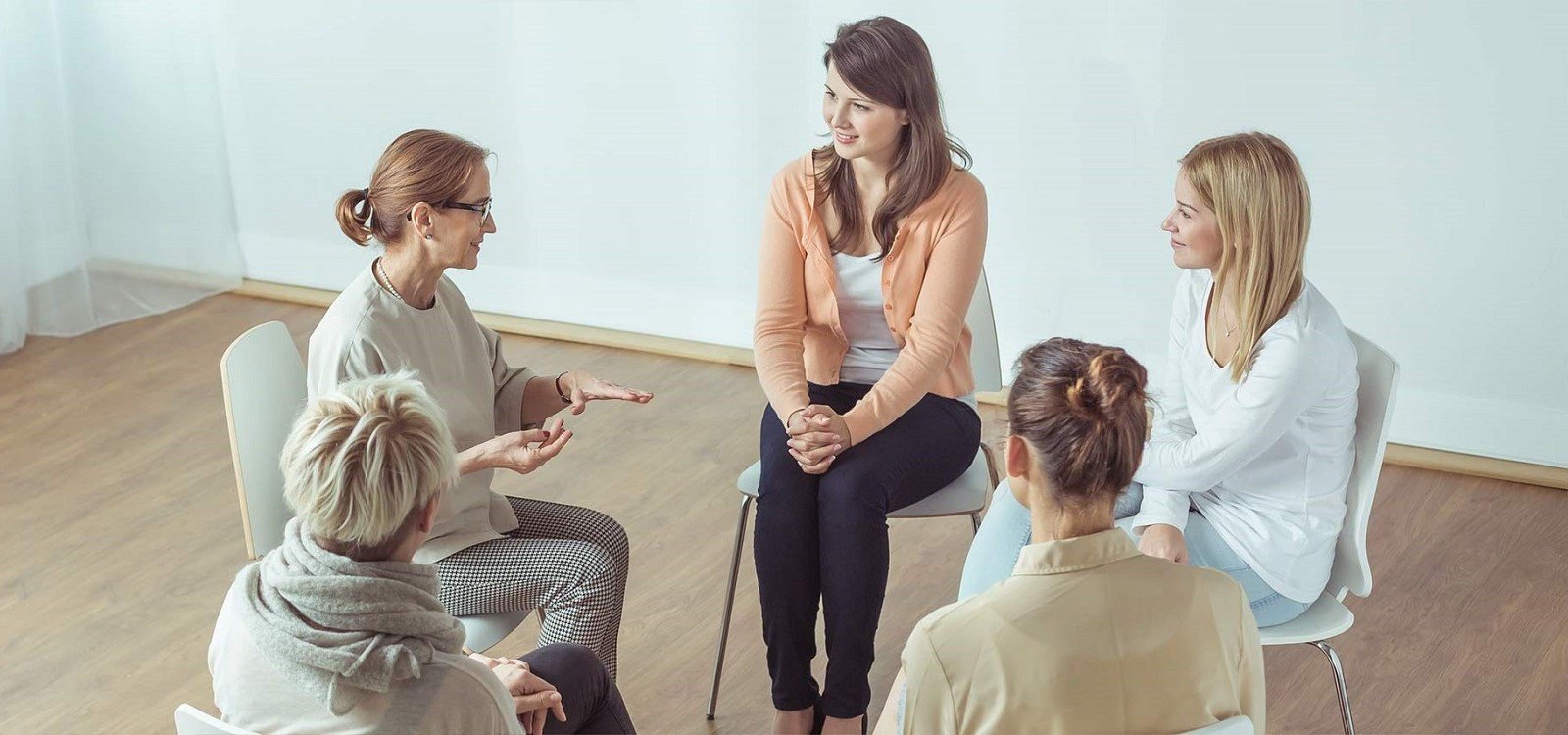 Support worker with a client in an aged-care setting, warm light